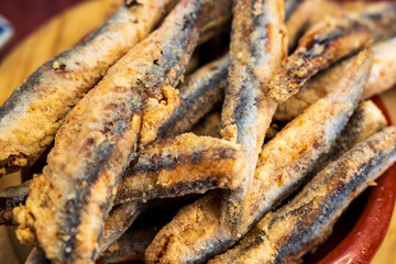 plate of 'baquerones; fresh anchovis fired in oil and served as tapa in Spain