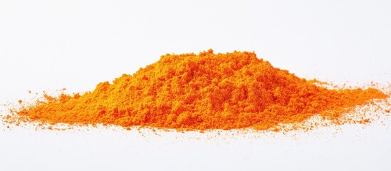 Vibrant orange powder illustration on a clean white background showcasing texture and color for culinary or artistic use.
