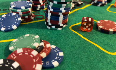 poker chips and cards on the green table background 