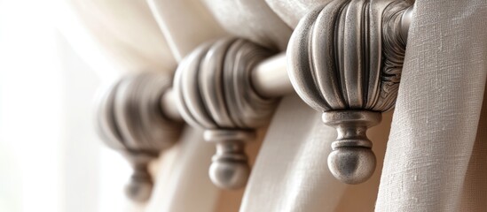 Elegant metal cornice endings with folded fabric drapery rod and decorative finials, enhancing home interior aesthetics.