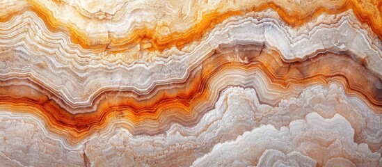 Fototapeta premium Natural sandstone rock formations showcasing vibrant earthy patterns and textures in warm hues of orange and cream.