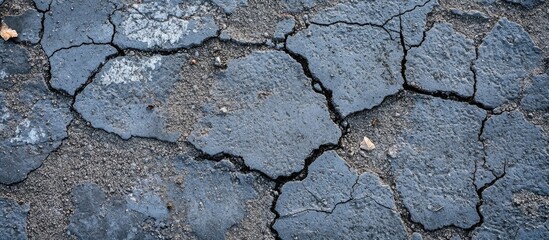 Cracked cement texture with rough surface detail suitable for backgrounds and design projects related to urban decay and construction.