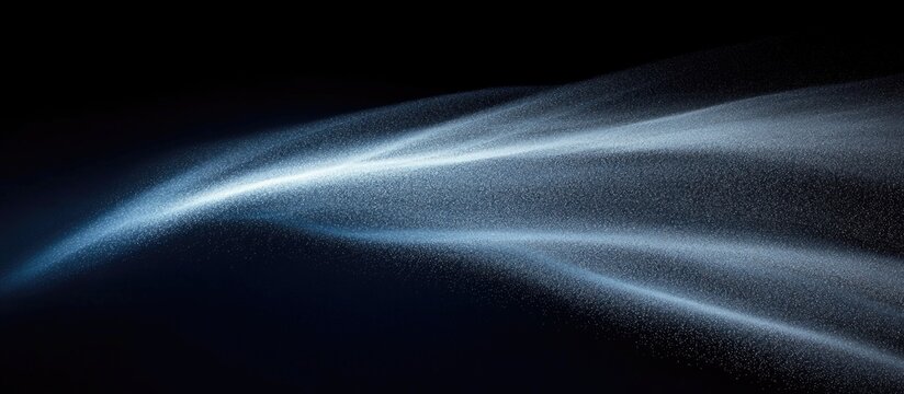 Dust particles flow in air creating a snowstorm effect on a dark blue background ideal for overlay in visual projects