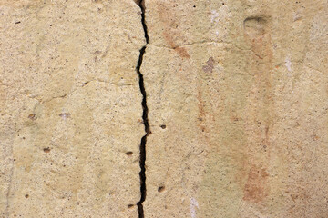 Cracked concrete wall and have rough surface , texture cement, close-up.