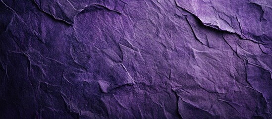Fototapeta premium Saturated deep purple recycled paper textured background with coarse grain and vignette for creative design projects and artistic applications