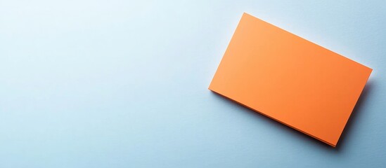 Orange Business Card on Light Blue Background with Blank Space for Custom Text or Branding