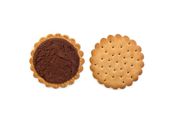Sandwich cookie with chocolate cream and hazelnuts isolated on white background.