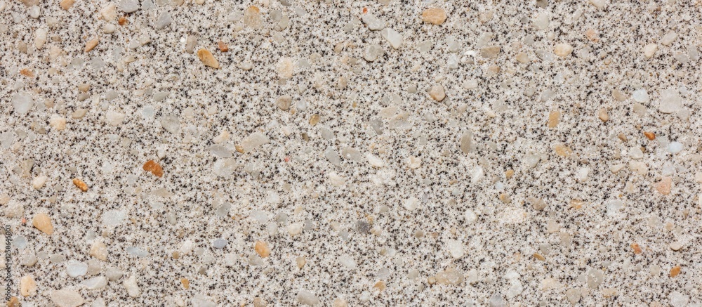 Aufkleber Natural sand texture background with varied grains and subtle colors ideal for design projects and creative applications.