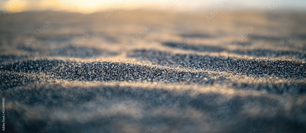 Aufkleber Morning beach sand texture with soft light reflecting on the surface creating a serene and calming coastal atmosphere.