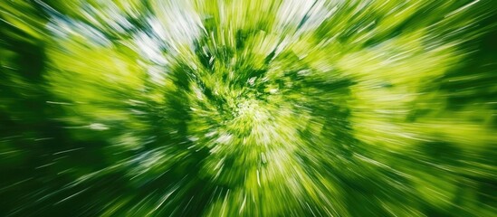 Obraz premium Vibrant Green Abstract Spin Blur Background for Dynamic Designs and Creative Projects