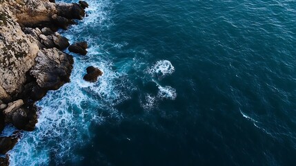 An Aerial View of Dramatic Ocean Waves Crashing Against Rugged Cliffs on a Clear Day Capturing Nature's Beauty : Generative AI