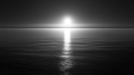 Monochromatic Serenity: Sun's Reflection on a Calm Dark Ocean Surface
