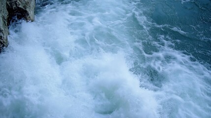 Dynamic ocean waves crashing onto rocky shore creating a beautiful coastal scene : Generative AI