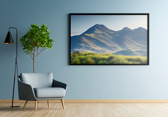 A large, black-framed photograph is hanging on the wall of an empty room with light blue and gray tones. The photo depicts distant mountains at dusk, and in front, there is a small green tree. 
