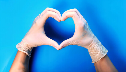 Obraz premium Hands form a heart shape with medical gloves, symbolizing care during health crises