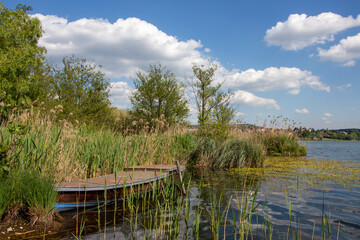 small boat moored in the reeds on Lake Varese