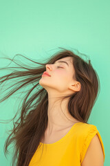 closeup photo of a young woman with long, flowing brown hair, tilting her head back with a serene, content expression.  