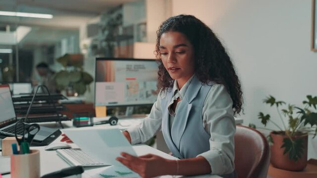 Business, documents and woman in office, finance and budget with report, profit review and deadline. Person, accountant and employee at desk, paperwork and computer with invoice and income growth