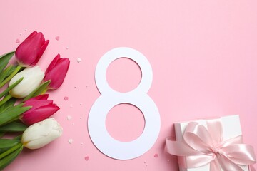 8 March greeting card design with tulip flowers and gift box , top view. Happy International Women's Day