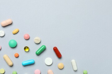 Various pills on gray background