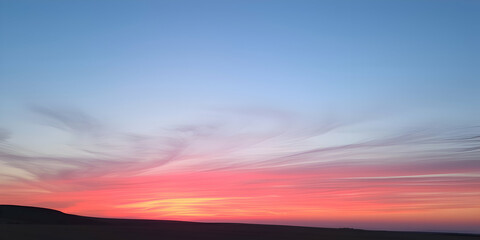 Fototapeta premium Captivating Sunset Over Desert Landscape with Vibrant Colors - Ideal for Travel Themes, Nature Photography, Inspirational Posters, and Environmental Campaigns