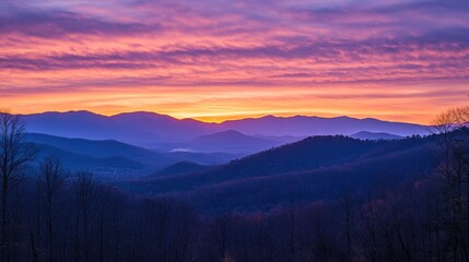 Obraz premium Majestic Sunrise Over Layered Mountain Ranges