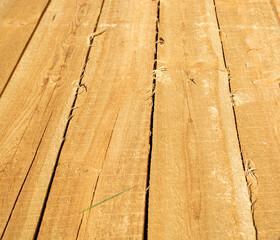 Sawn planks lie in the sun. Drying and selling timber.