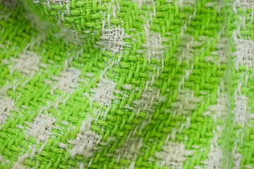 The fabric of a green and white sweater
