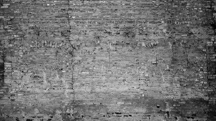 gray background, photo shows texture of brick wall of old building