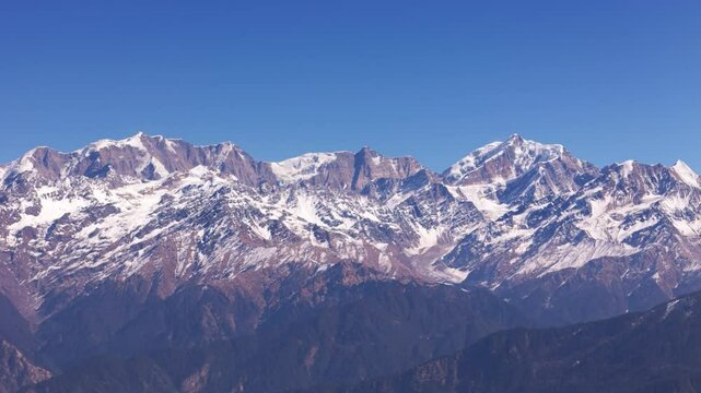 A striking visual of draupadi ka danda are two peaks beautiful himalyan peaks, showcasing the natural beauty and scenic wonders of the region.
