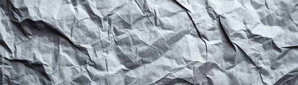 Poster textured, crumpled gray paper background suitable for design, art projects, or presentations. this v