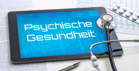 Ein Tablet mit dem Text Psychische Gesundheit auf dem Display