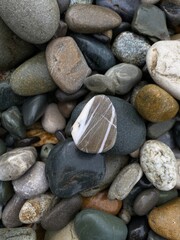 Beach pebble texture. Beautiful pebbles close-up. Natural stone background.
