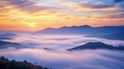 Obraz premium Serene Misty Sunrise Over Majestic Mountain Landscape in Autumn