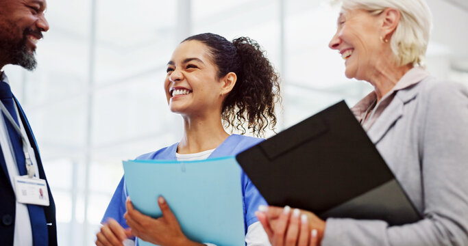 Doctors, discussion and documents at hospital in hallway for breakthrough, progress or solution for medical crisis. Clinic director, man and woman with nurse, surgeon or diversity for health services