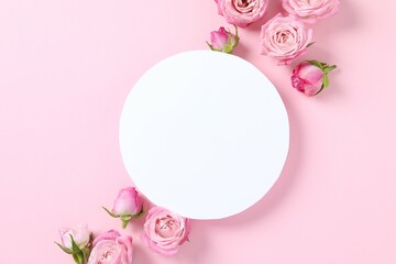 Beautiful composition with pink roses on color background 