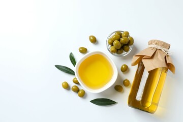 Bottle of fresh olive oil and olives with leaves on white background
