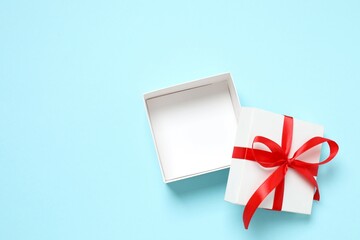 Beautiful gift box on color background