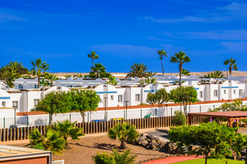Apartments in Corralejo with faint silhouettes of volcanoes in the background