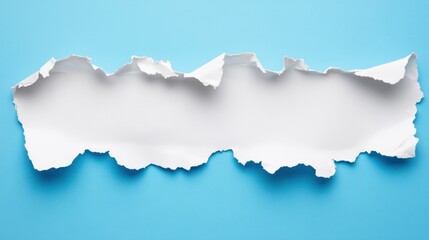 Obraz premium Torn white paper with a ripped edge against a vibrant blue background for creative design and art projects