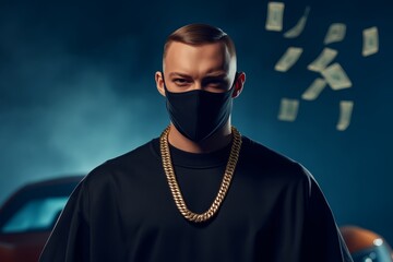 Obraz premium Stylish man in a black mask and gold chain posing confidently with money floating in urban nightlife ambiance