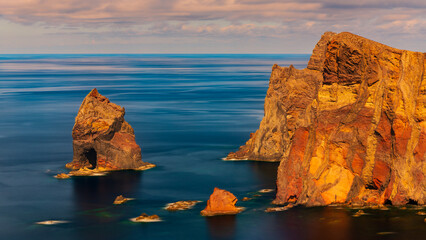 The easternmost part of the Portuguese island of Madeira is called Ponto sao Lourenco. The colourful cliffs are surrounded by the Atlantic Ocean. The easternmost tip of Madeira at sunrise