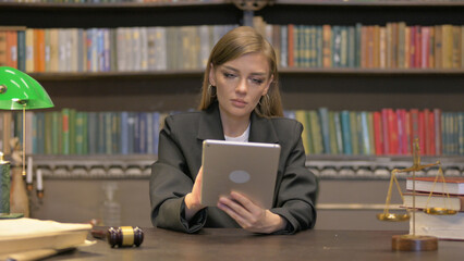 Female Lawyer Using Tablet in Office