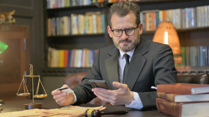 Middle Aged Lawyer Having Online Banking Problem