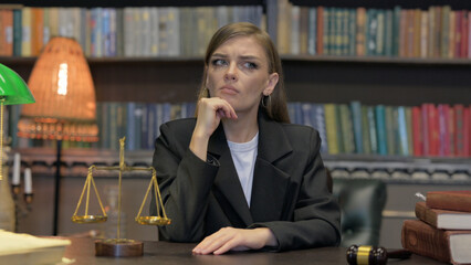 Portrait of Female Lawyer Brainstorming while in Office