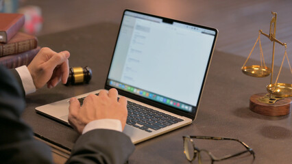 Close up of Male Lawyer Working on Laptop