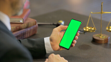 Male Lawyer Using Chroma Key Smartphone in Office
