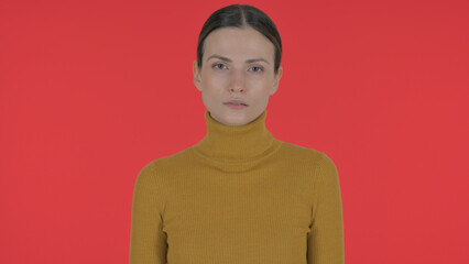 Fototapeta premium Serious Casual Young Woman on Red Background, Portrait
