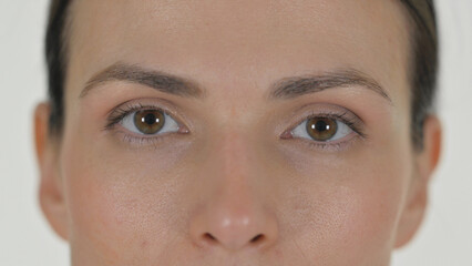 Close up of Female Blinking Eyes on White Background