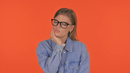 Casual Young Woman with Tooth Pain on Orange Background, Portrait